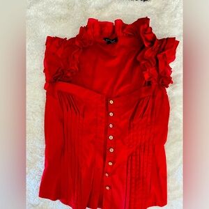 Bebe ruffle sleeveless top.